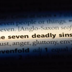 the seven deadly sins word in a dictionary. the seven deadly sins concept.
